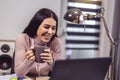 Woman working with laptop at the working place with computers in the studio Royalty Free Stock Photo