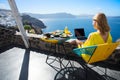 Woman working with laptop while on vacation in Mediterranean Royalty Free Stock Photo