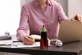 Woman working at messy table, closeup. Startup concept