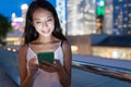 Woman working on mobile phone at night Royalty Free Stock Photo