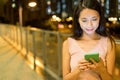 Woman working on mobile phone at night Royalty Free Stock Photo