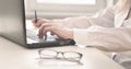 Woman working on modern computer. Laptop keyboard detail with beautiful nails hand.Quarantine, isolation and work from home during Royalty Free Stock Photo