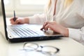 Woman working on modern computer. Laptop keyboard detail with beautiful nails hand.Quarantine, isolation and work from home during Royalty Free Stock Photo