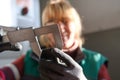 woman working in a modern factory and preparing materia for a CNC machine. Royalty Free Stock Photo