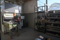 woman working in a modern factory and preparing materia for a CNC machine. Royalty Free Stock Photo