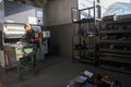 woman working in a modern factory and preparing materia for a CNC machine. Royalty Free Stock Photo