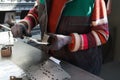 woman working in a modern factory and preparing materia for a CNC machine. Royalty Free Stock Photo