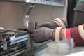 woman working in a modern factory and preparing materia for a CNC machine. Royalty Free Stock Photo