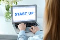 Woman working on modern laptop at table indoors, closeup. Startup idea