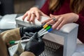 woman working in a nail salon offers a color of nail polish to one of her clients and smiles. Royalty Free Stock Photo