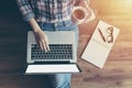 Woman working with notebook laptop computer, using finger with keyboard for typing. computer laptop with blank white screen. Royalty Free Stock Photo