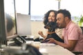 Woman Working In Office Based Business Training Man With Down Syndrome Holding Pet Dachsund Dog Royalty Free Stock Photo
