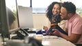 Woman Working In Office Based Business Training Man With Down Syndrome Holding Pet Dachsund Dog Royalty Free Stock Photo