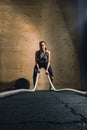 Woman working out with battle ropes Royalty Free Stock Photo