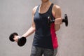 Woman working out with dumbbell in a gym Royalty Free Stock Photo