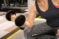 Woman working out with dumbbell in a gym Royalty Free Stock Photo