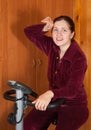 Woman working out on exercycle Royalty Free Stock Photo