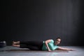 Woman working out her side body doing side plank variation