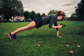 Woman working out with resistance band in the park Royalty Free Stock Photo