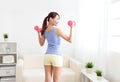 Woman working out with two dumbbells Royalty Free Stock Photo