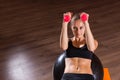 Woman Working Out with Weights and Exercise Ball Royalty Free Stock Photo
