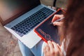 Woman working outdoors using laptop and tablet. Graphic designer working remotely. Top view Royalty Free Stock Photo