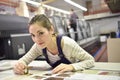 Woman working in printing industry Royalty Free Stock Photo