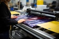 a woman working with a printing machine in a factory Royalty Free Stock Photo