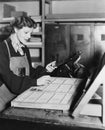 Woman working in printing shop Royalty Free Stock Photo
