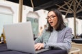 Woman working on remote from outdoor cafe Royalty Free Stock Photo