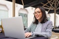 Woman working on remote from outdoor cafe Royalty Free Stock Photo