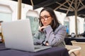 Woman working on remote from outdoor cafe Royalty Free Stock Photo