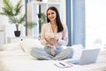 Woman working remotely from home, typing on modern wireless cell phone. Royalty Free Stock Photo