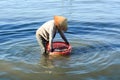 Woman working at seashore in Nhatrang Royalty Free Stock Photo