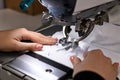 Woman working with sewing machine in professional workshop, closeup Royalty Free Stock Photo