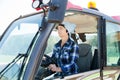 woman working on small farm tractor Royalty Free Stock Photo