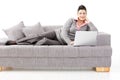 Woman working on sofa