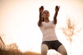 Woman working squats in nature.  Training for legs Royalty Free Stock Photo