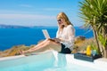 Woman working while on vacation in Mediterranean Royalty Free Stock Photo