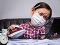 Woman working with very busy business and housework part, ironing cloth, talking on phone and working with laptop during isolation Royalty Free Stock Photo