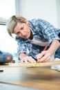 Woman working with wood planks