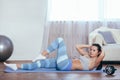 Woman workout at home, her sit up Royalty Free Stock Photo