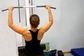 Woman workout with lat pulldown at the gym.