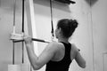 Woman workout with lat pulldown at the gym.