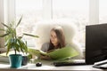 Woman works at home, parses documents Royalty Free Stock Photo