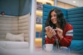 Woman works with a smartphone in the office