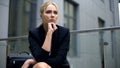 Woman worried about dismissal from work, sitting on bench, feeling depression Royalty Free Stock Photo