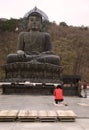 A woman worshiping at Buddha Statue, Seoraksan National Park, Sokcho, Korea