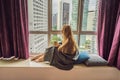 Woman wrapped in a blanket and looking at the big city Royalty Free Stock Photo