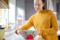 Woman Wrapping Food Bowl In Reusable Environmentally Friendly Beeswax Wrap